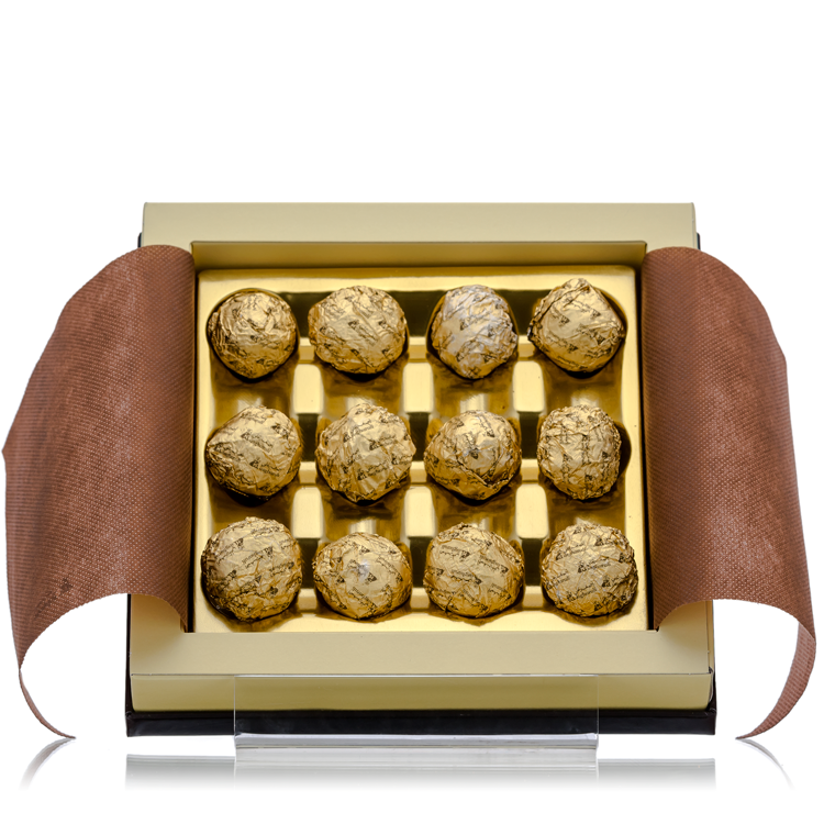 Open box of Bakhoor Estabraq displaying 16 golden bakhoor tablets