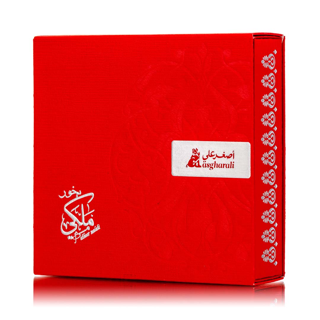 A red box of Bakhoor Malaki with white text and decorative elements, indicating it is a product related to oudh & bakhoor.