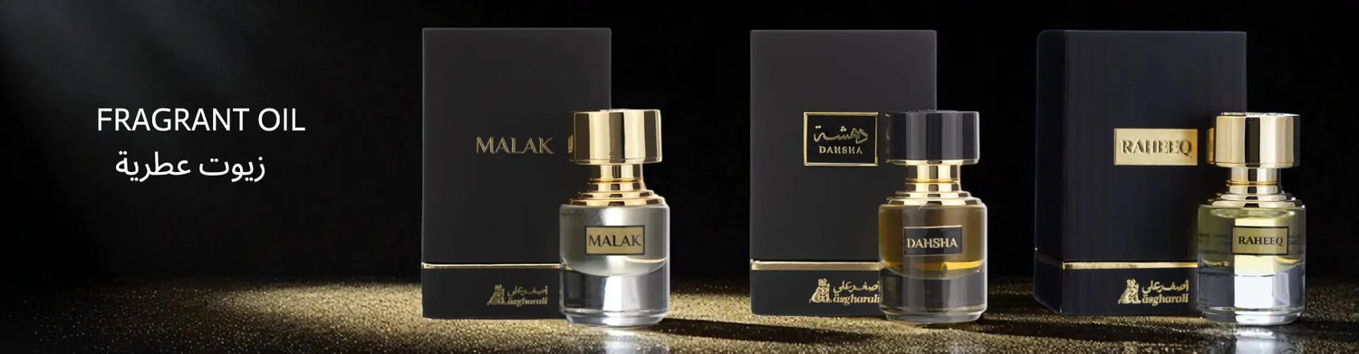 Three fragrant oil bottles with visible brand names on a dark background